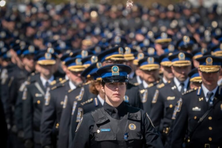 Wall of police officers in blue and black.