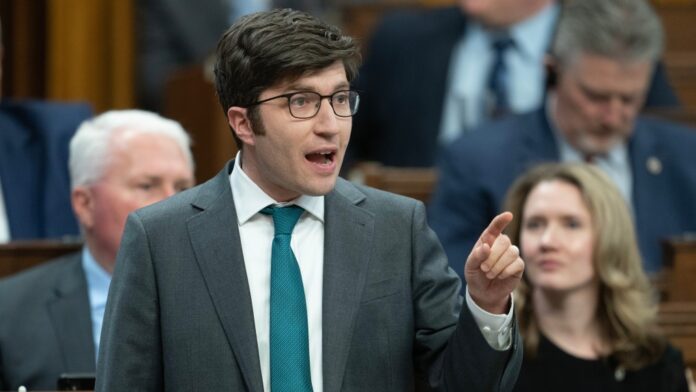 Conservative MP for Sherwood Park-Fort Saskatchewan Garnett Genuis rises during Question Period, in Ottawa, Monday, April 15, 2024. THE CANADIAN PRESS/Adrian Wyld