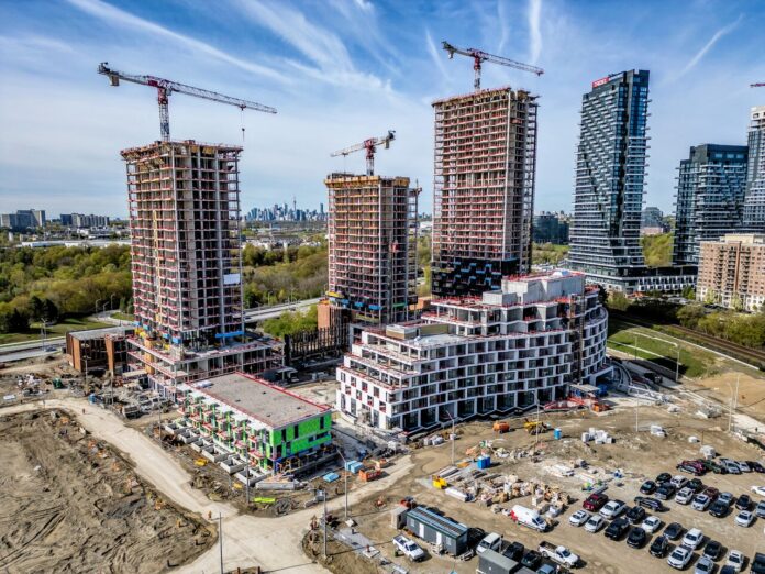 Cladding Going Up for Crosstown Towers as Two Cranes Come Down