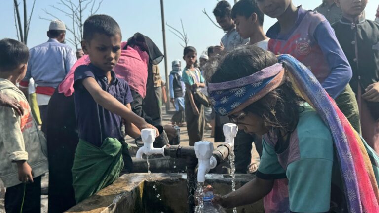 Rohingya refugee children collect drinking water after a midnight fire raced through their refugee camp at Kutupalong in Cox's Bazar district, Bangladesh, Sunday, Jan. 7, 2024. THE CANADIAN PRESS/AP-Shafiqur Rahman