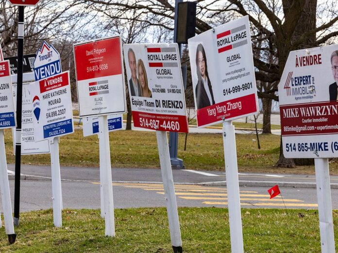 Real estate sales signs in the Dorval suburb of Montreal in April. 