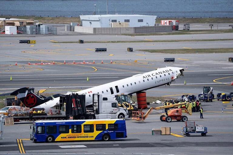 Crews remove the wreckage of an Air Canada plane from the runway at LaGuardia Airport following a fatal collision with a fire truck earlier this week in New York, March 25, 2026. / Photo credit: Lokman Vural Elibol/Anadolu via Getty Images