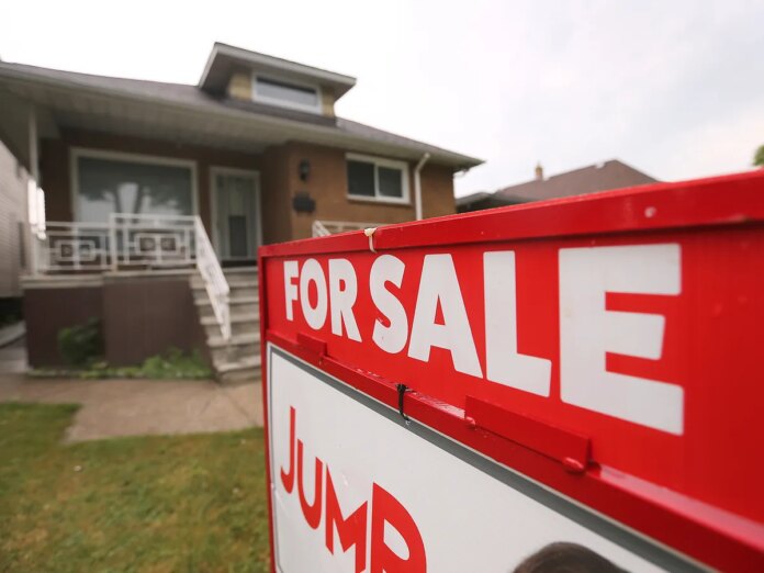 A for sale sign is seen on a home on Howard Avenue in Windsor on Wednesday, July 9, 2025. 