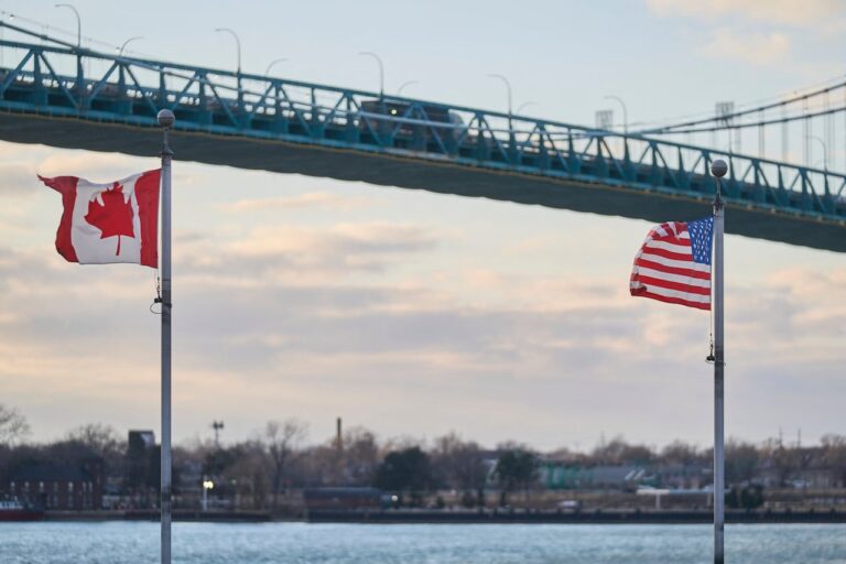 A truck crosses the Ambassador Bridge, the border crossing between Windsor, Ontario, Canada, and Detroit, Michigan, above the Canadian Vietnam Veterans Memorial on March 1, 2025.